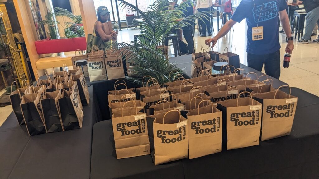 table full off lunch bags for the attendees. food was provided by ColorCode organizers.